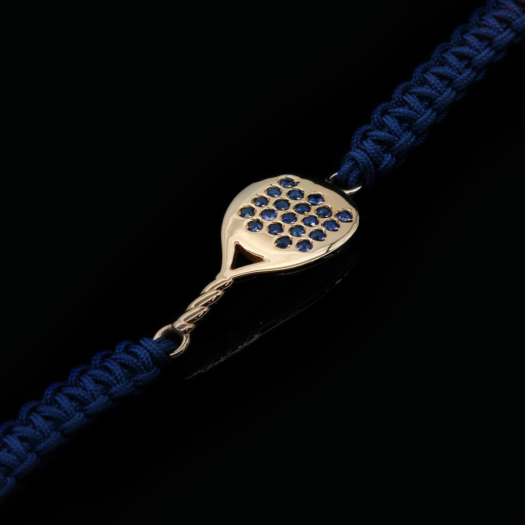 BRACCIALE PADEL IN ORO GIALLO 18KT E ZAFFIRI BLU MODELLO TONDA CON CORDINO SCOOBYDOO BLU NAVY INTRECCIATO A MANO
