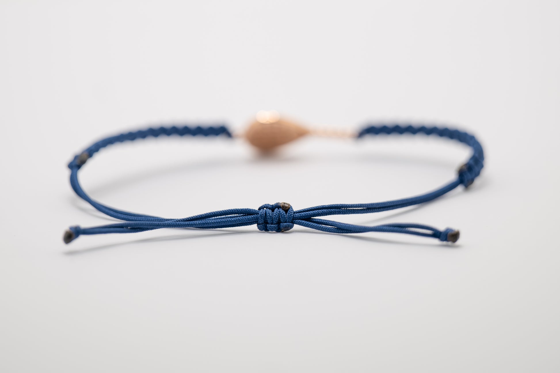DETTAGLIO CORDINO BRACCIALE PADEL IN ORO ROSA 18 KT